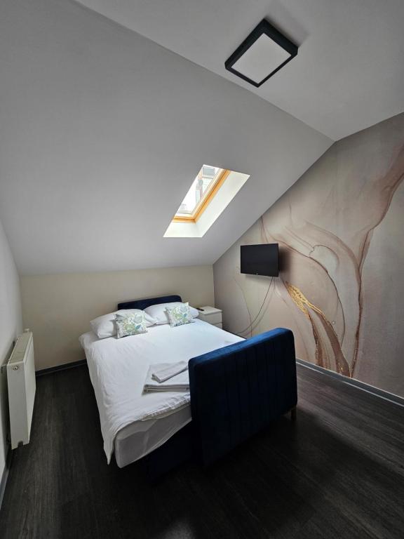 Postel nebo postele na pokoji v ubytování KAPTOL Rooms