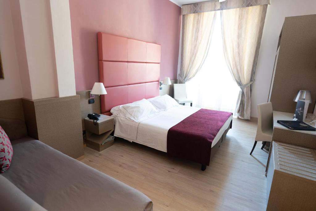 Posteľ alebo postele v izbe v ubytovaní Hotel Ligure