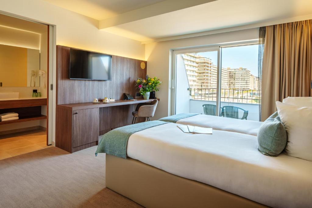 Postel nebo postele na pokoji v ubytování Dune Hotel Nieuwpoort
