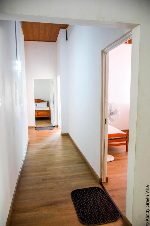 Postel nebo postele na pokoji v ubytování Kandy Green Villa