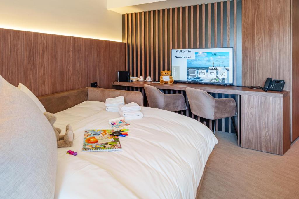 Postel nebo postele na pokoji v ubytování Dune Hotel Nieuwpoort