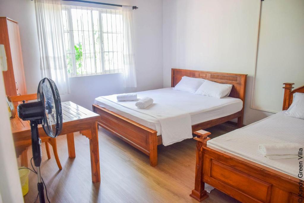 Postel nebo postele na pokoji v ubytování Kandy Green Villa