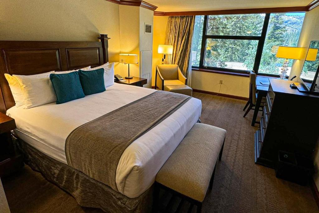 a hotel room with a large bed and a desk at Everline #350 in Olympic Valley