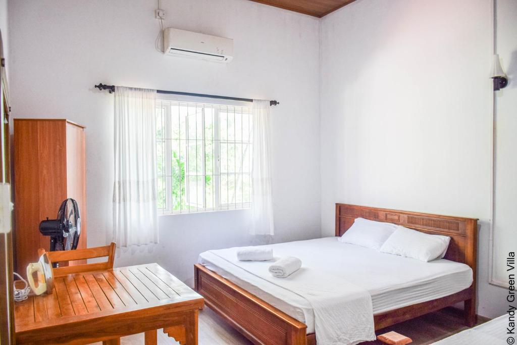 Postel nebo postele na pokoji v ubytování Kandy Green Villa