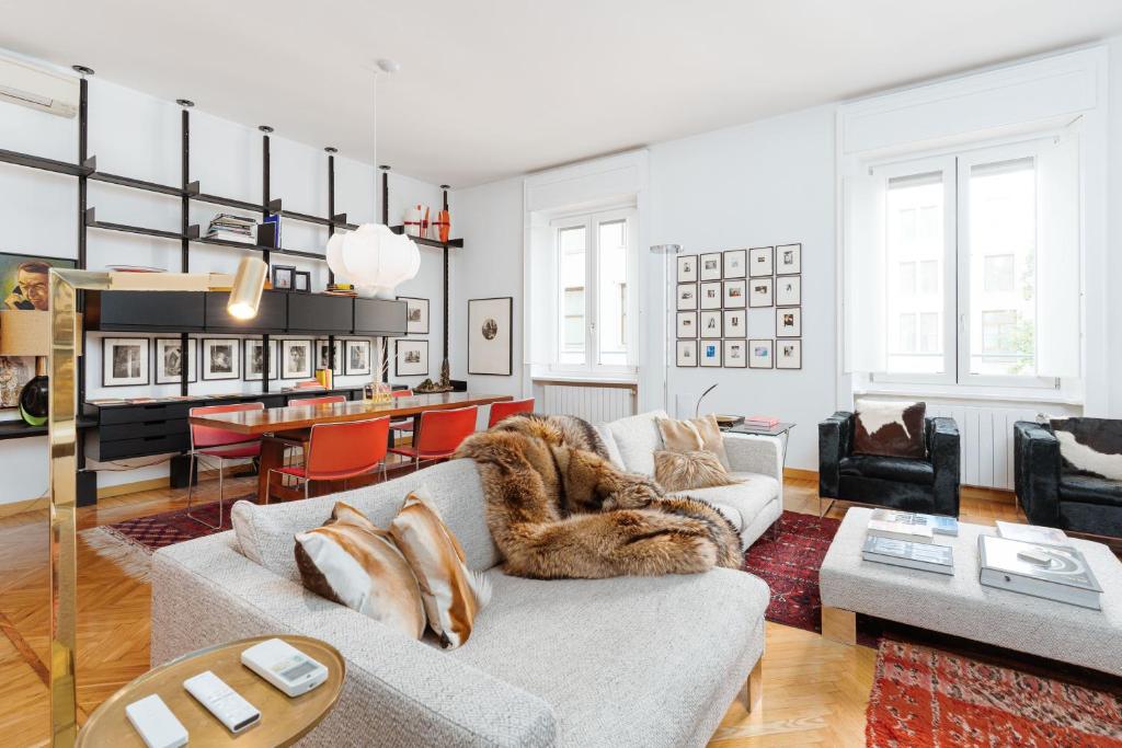 a living room with a couch and a table at Youhosty - Brera 17 in Milan