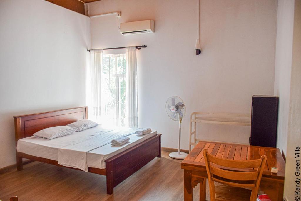 Postel nebo postele na pokoji v ubytování Kandy Green Villa