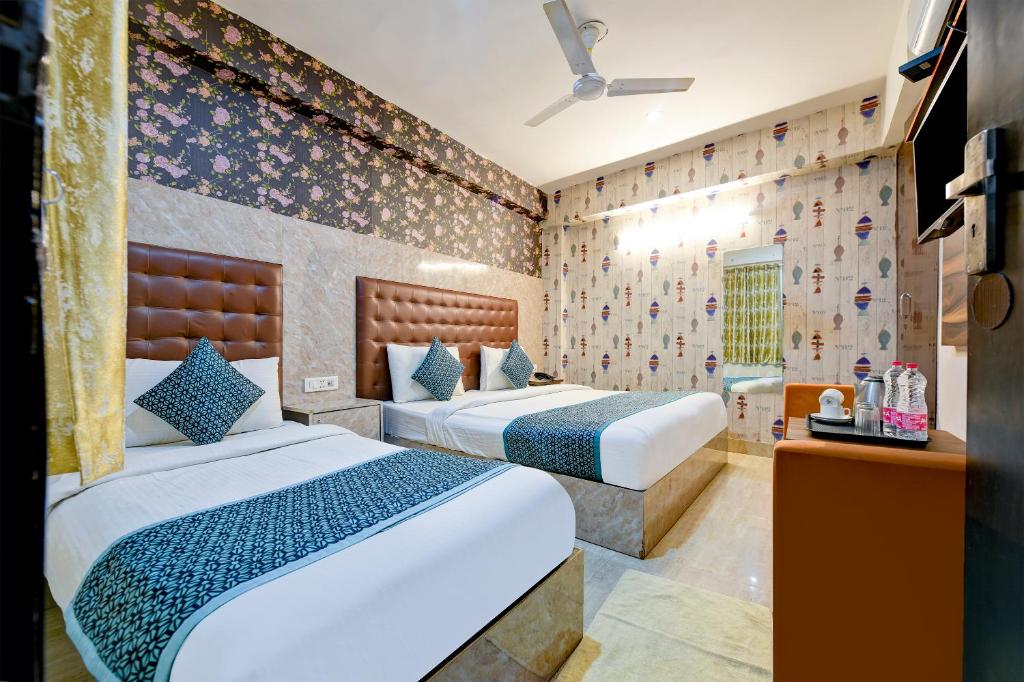 Postel nebo postele na pokoji v ubytování Hotel Palm Suites A Family Hotel Near Terminal 3