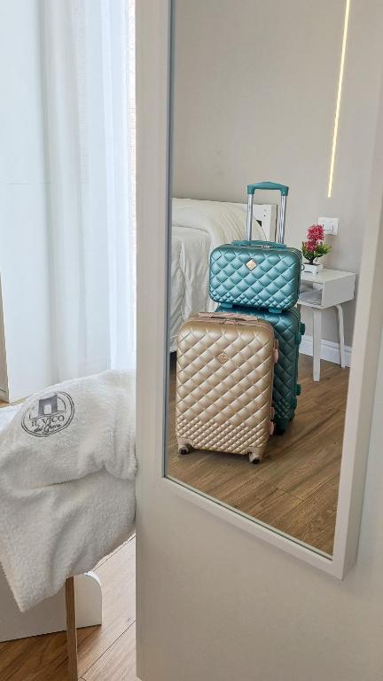 Postel nebo postele na pokoji v ubytování Il Vico del Greco B&B