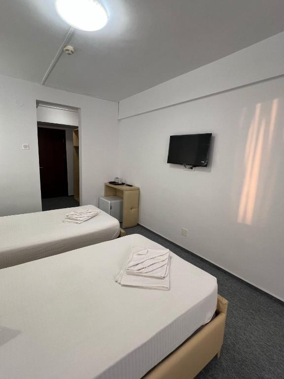 Postel nebo postele na pokoji v ubytování Hotel viilor