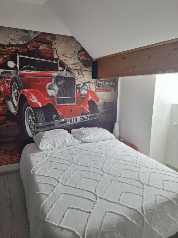 Postel nebo postele na pokoji v ubytování Chez Eric - L'Atypique