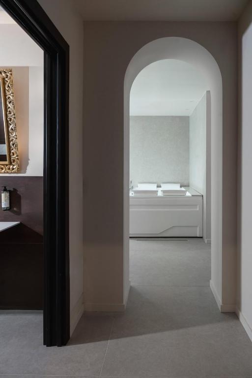 Postel nebo postele na pokoji v ubytování Hotel Parma e Oriente Wellness & Spa