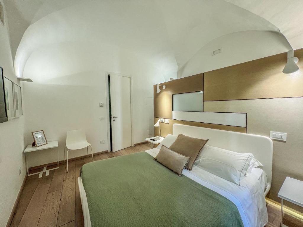 Postel nebo postele na pokoji v ubytování Santacroce Luxury Rooms