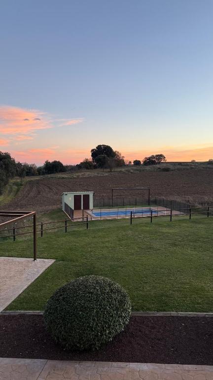 The sunrise or sunset as seen from the country house or nearby