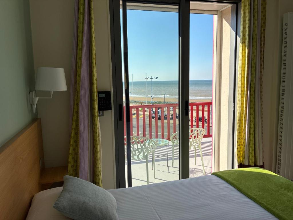 Postel nebo postele na pokoji v ubytování Hôtel Outre-Mer - Villa Le Couchant