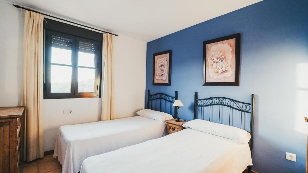 Posteľ alebo postele v izbe v ubytovaní Apartamento El Molino by Fontanilla Del Mar Holidays Rentals