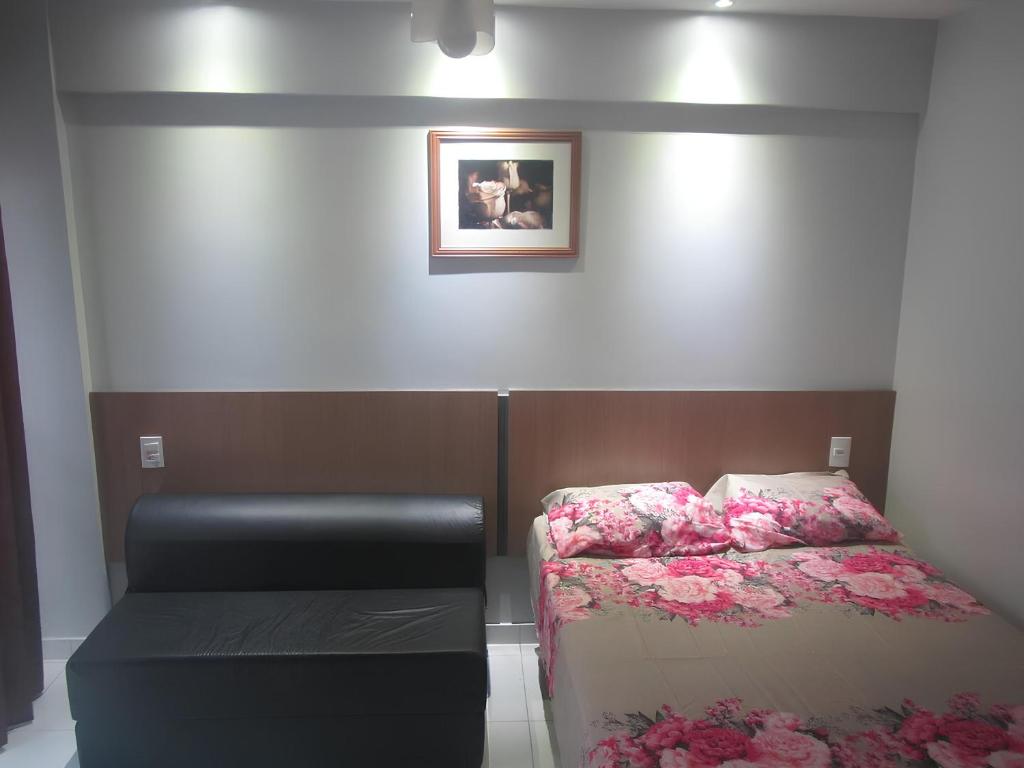 Ένα ή περισσότερα κρεβάτια σε δωμάτιο στο LAGOA QUENTE FLATS