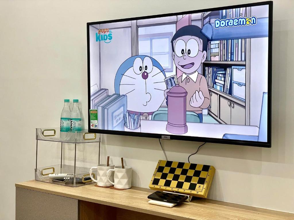 TV a/nebo společenská místnost v ubytování 2 Phòng Ngủ Riêng Biệt Cho Hộ Gia Đình 4 Người