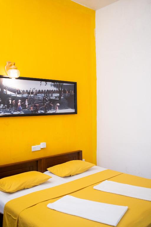 Postel nebo postele na pokoji v ubytování Fortuna Heritage Home