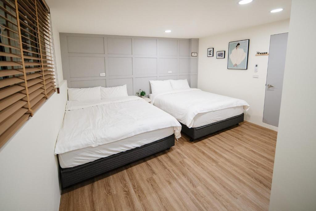 Postel nebo postele na pokoji v ubytování Shishi Homestay