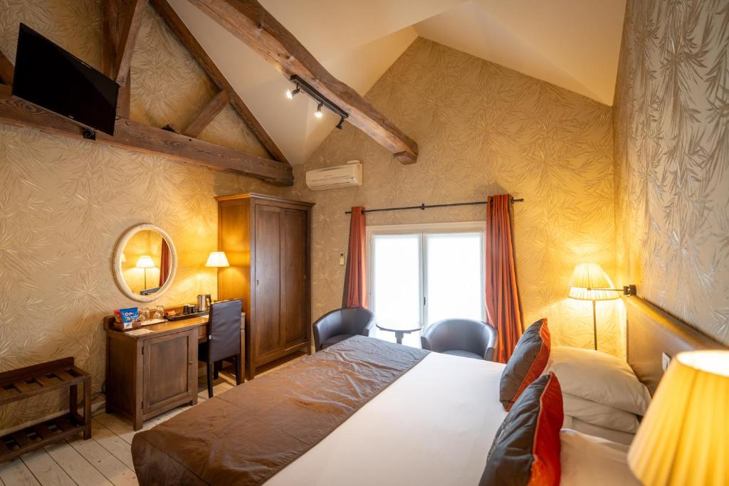 Postel nebo postele na pokoji v ubytování Hotel Jan Brito