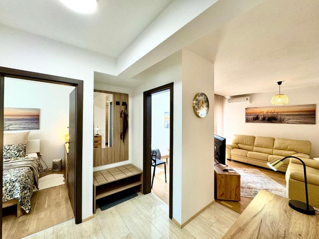 a room with a bed and a living room at Apartments Terra Solaris in Medulin