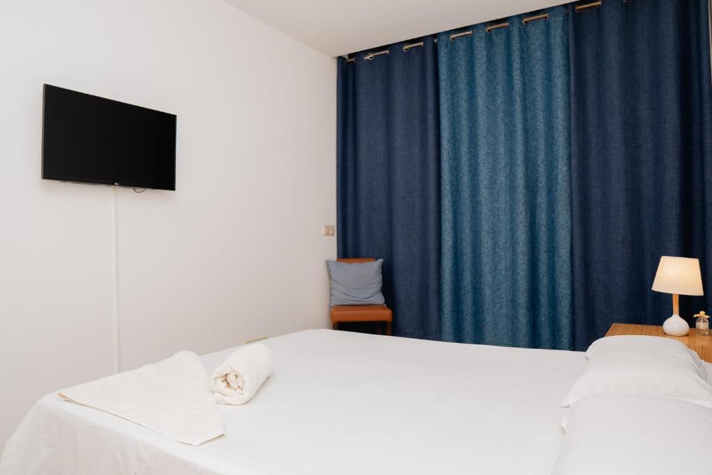 Postel nebo postele na pokoji v ubytování Kriol Guest House
