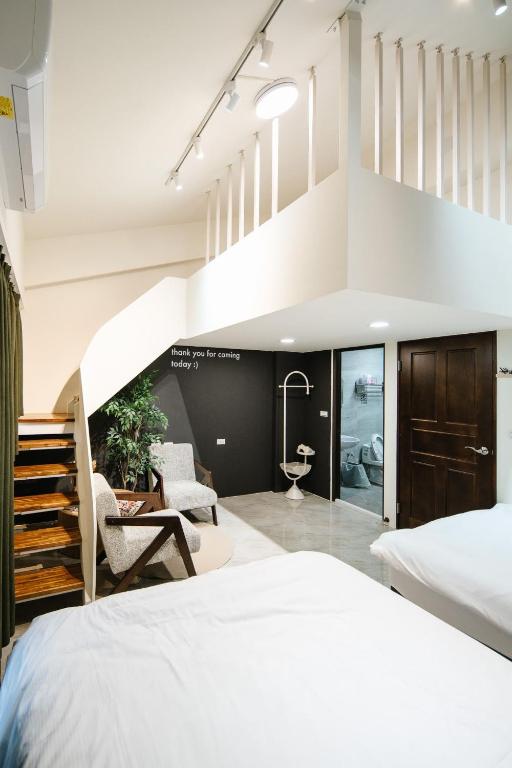 Postel nebo postele na pokoji v ubytování Shishi Homestay