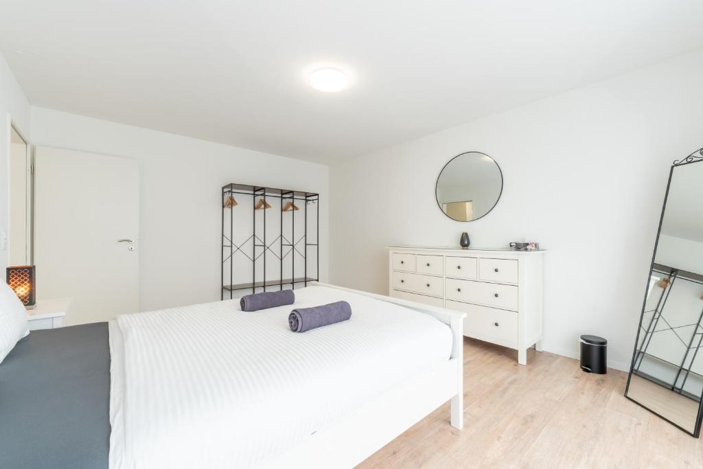 Postel nebo postele na pokoji v ubytování Swiss Suites
