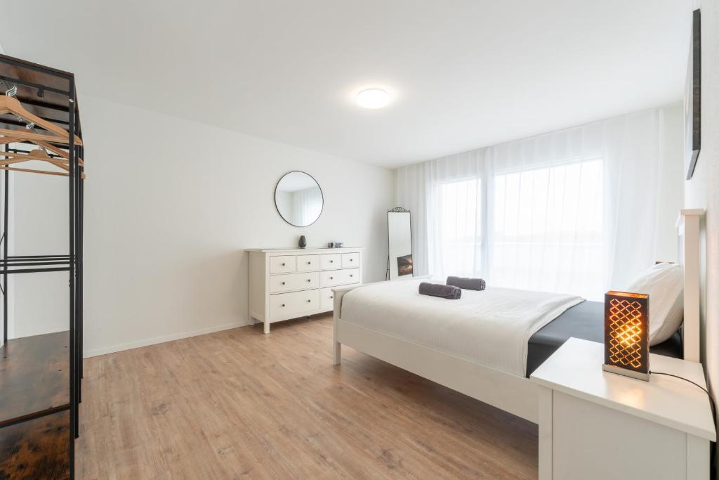 Postel nebo postele na pokoji v ubytování Swiss Suites