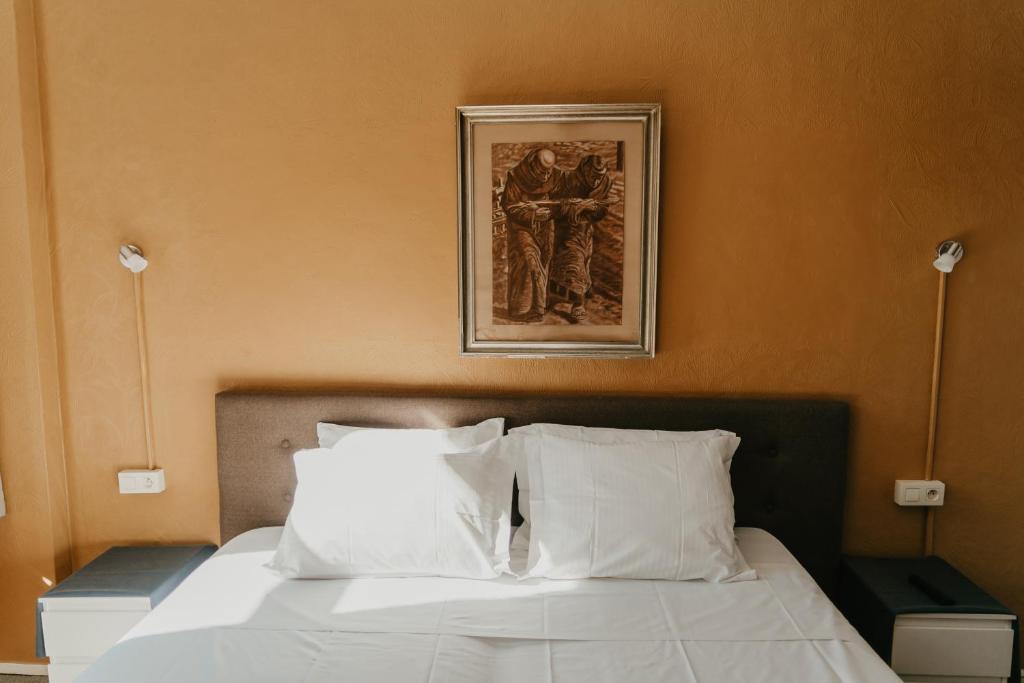 Postel nebo postele na pokoji v ubytování Hotel Cavalier