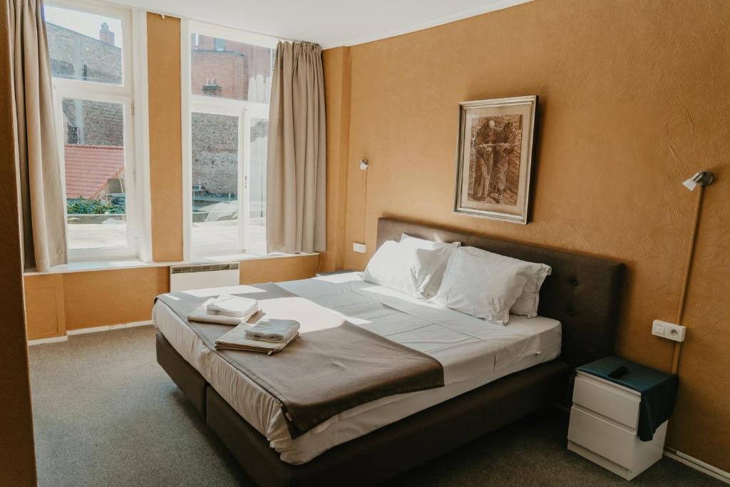 Postel nebo postele na pokoji v ubytování Hotel Cavalier