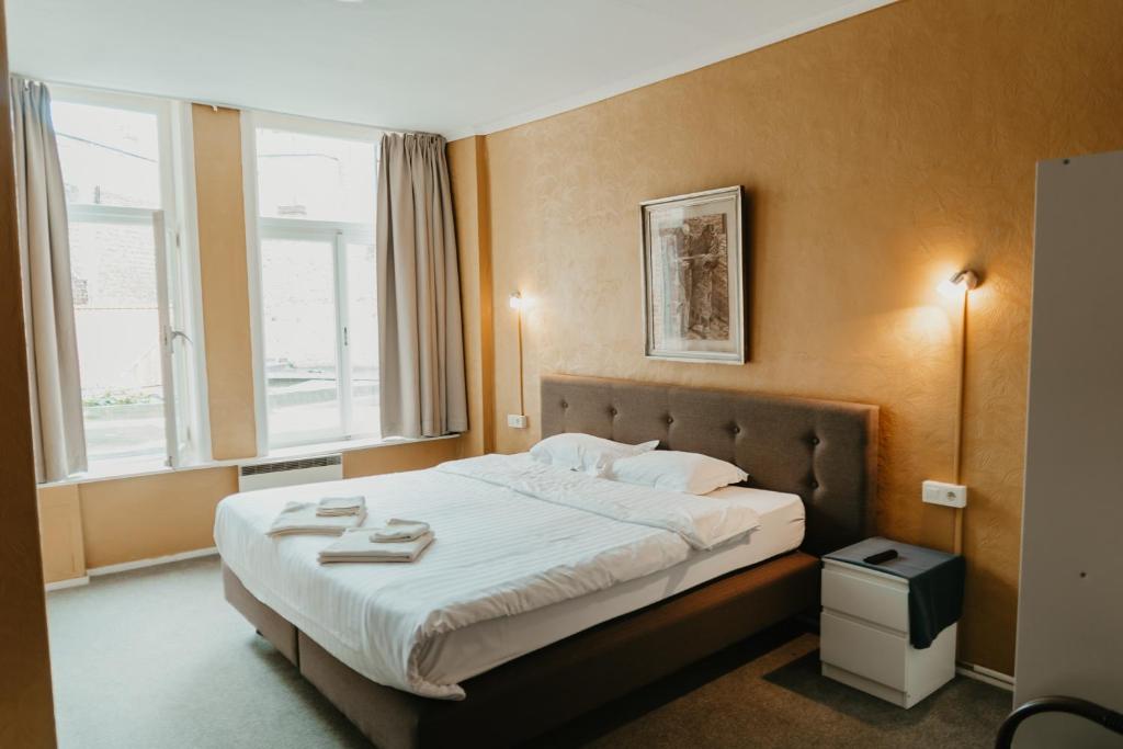 Postel nebo postele na pokoji v ubytování Hotel Cavalier
