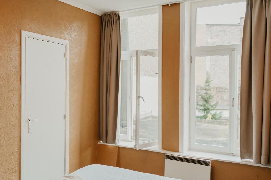 Postel nebo postele na pokoji v ubytování Hotel Cavalier