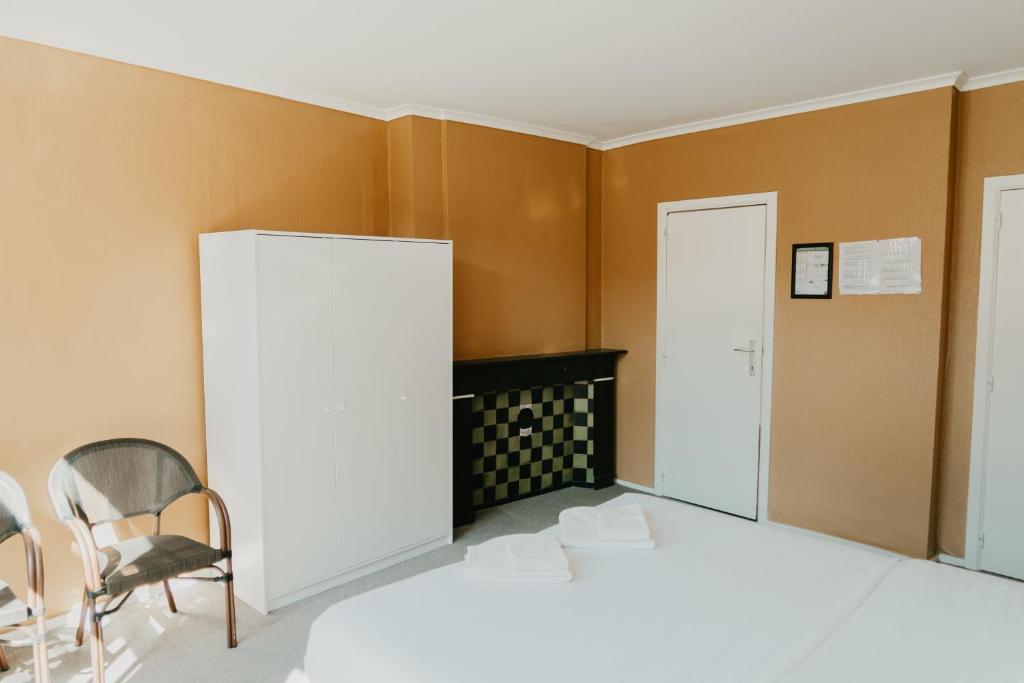 Postel nebo postele na pokoji v ubytování Hotel Cavalier