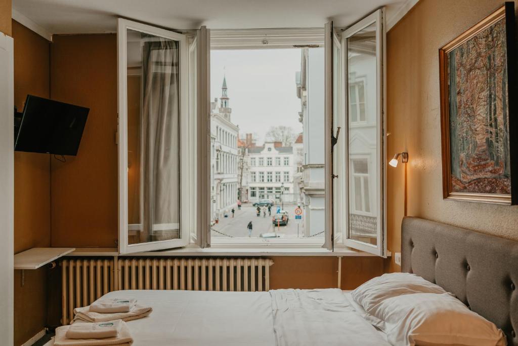 Postel nebo postele na pokoji v ubytování Hotel Cavalier