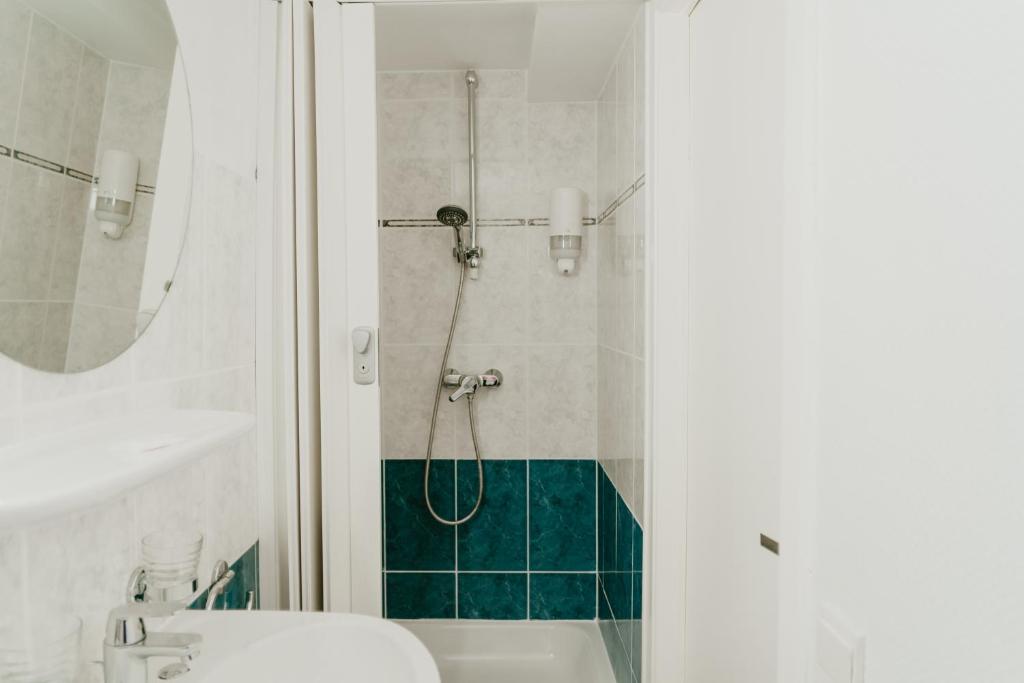 Koupelna v ubytování Hotel Cavalier