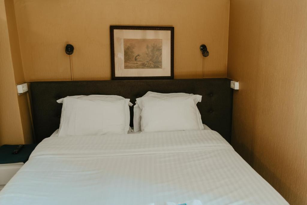 Postel nebo postele na pokoji v ubytování Hotel Cavalier