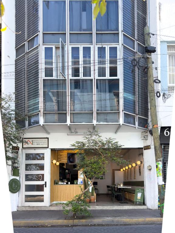 a building with a table in front of it at Estudios by Flor y tierra in Guadalajara
