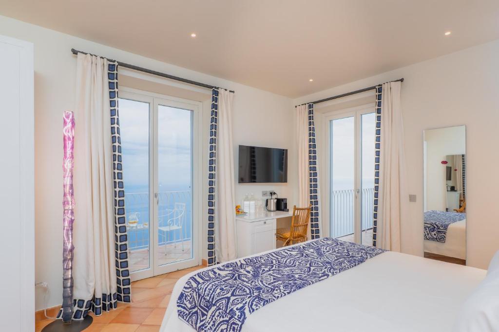 Postel nebo postele na pokoji v ubytování Five Positano