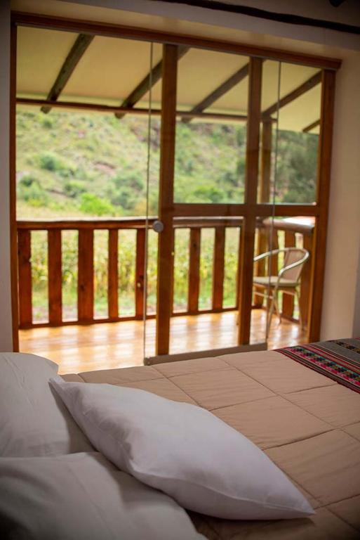 Postel nebo postele na pokoji v ubytování Casita Huaran