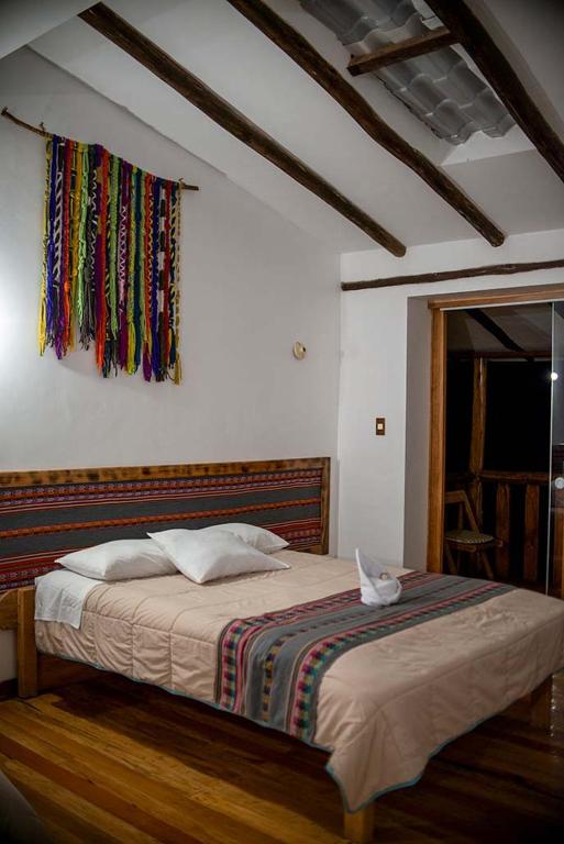 Postel nebo postele na pokoji v ubytování Casita Huaran