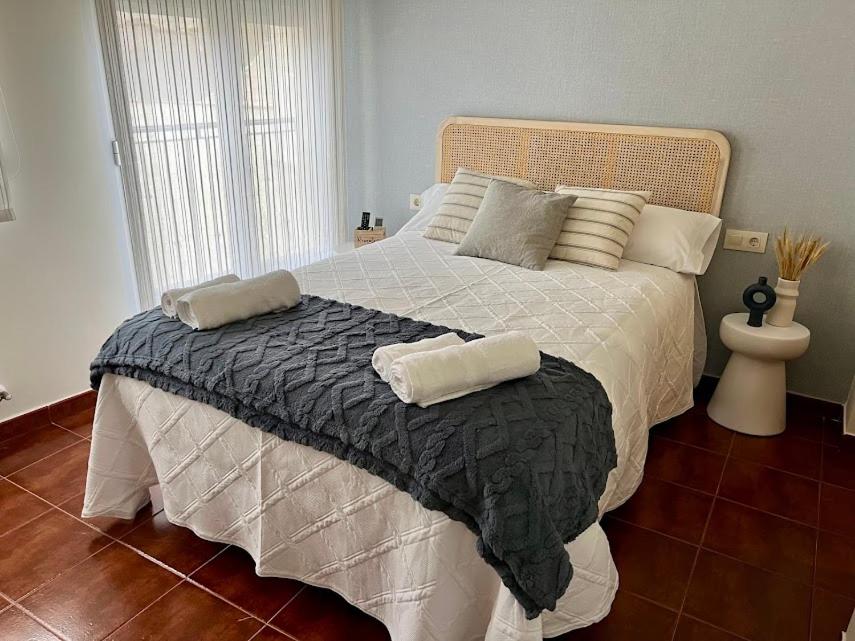 a large bed with two pillows on it in a bedroom at REFUGiO MAGiCO in Herencia