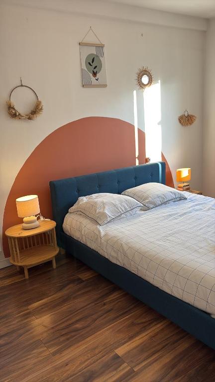 Ένα ή περισσότερα κρεβάτια σε δωμάτιο στο Appartement Design proche Paris