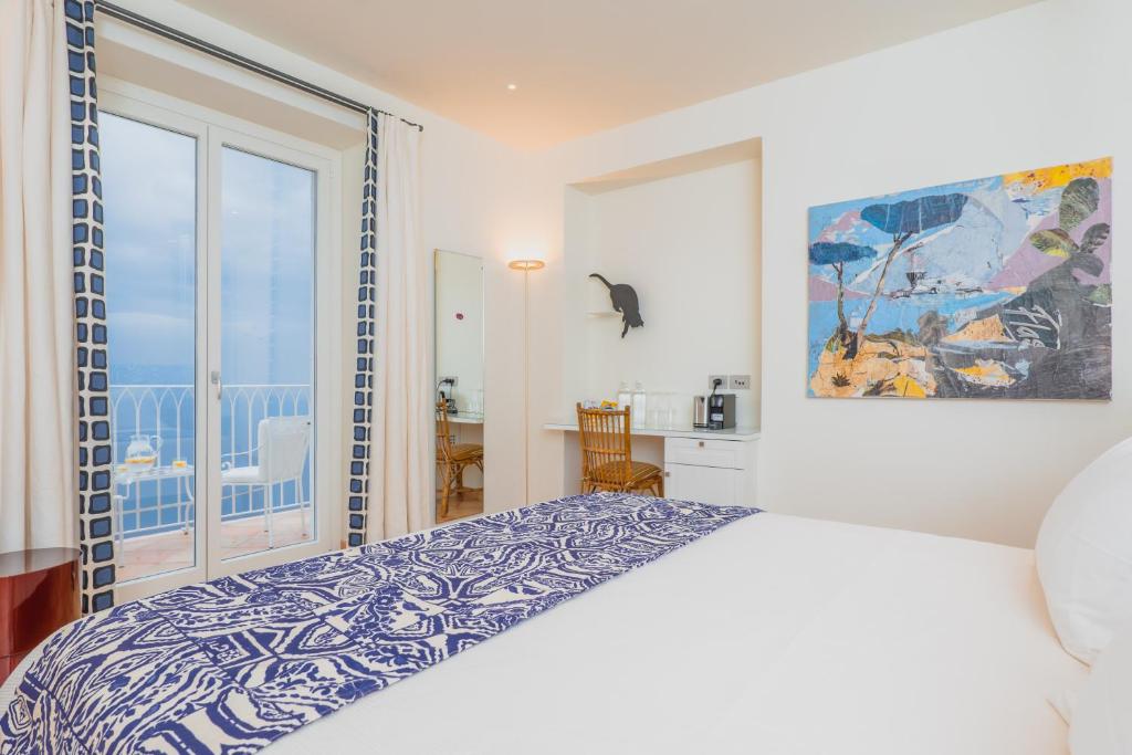 Postel nebo postele na pokoji v ubytování Five Positano