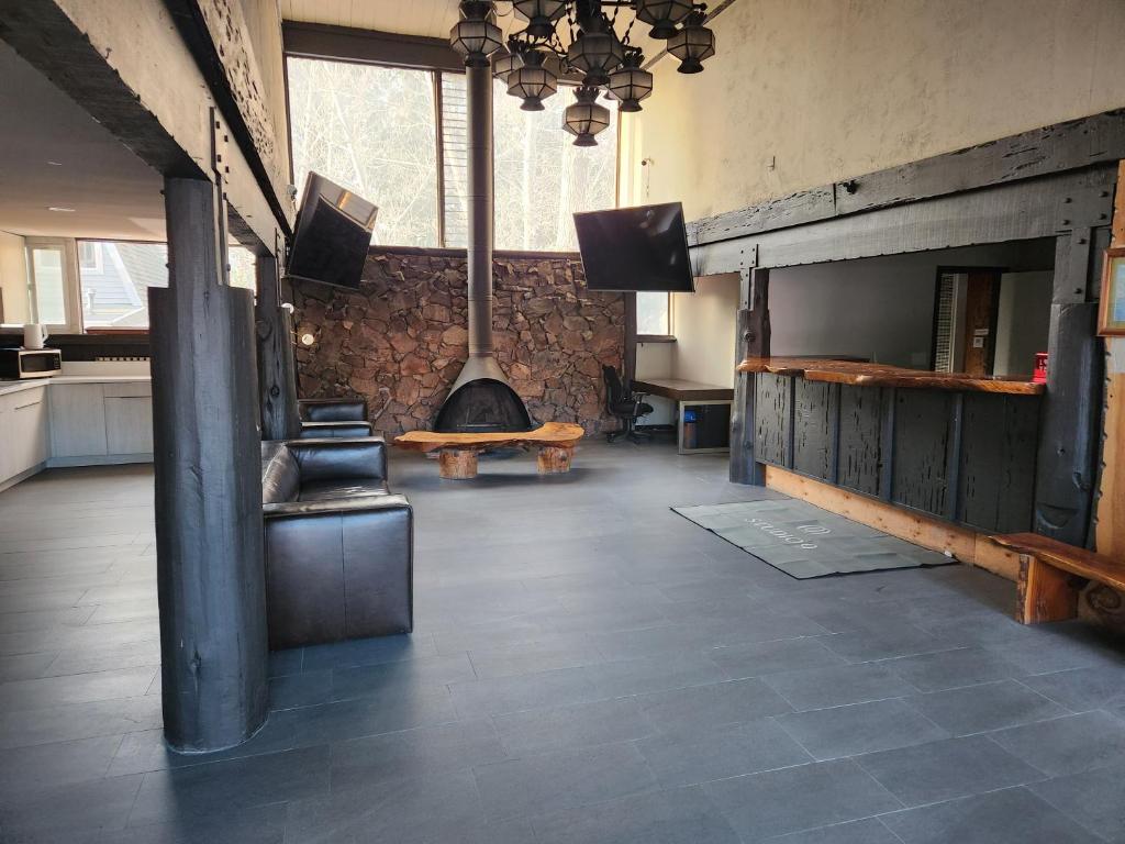 a large room with a stove in the middle of a building at Studio 9 Big Bear Lake in Big Bear Lake