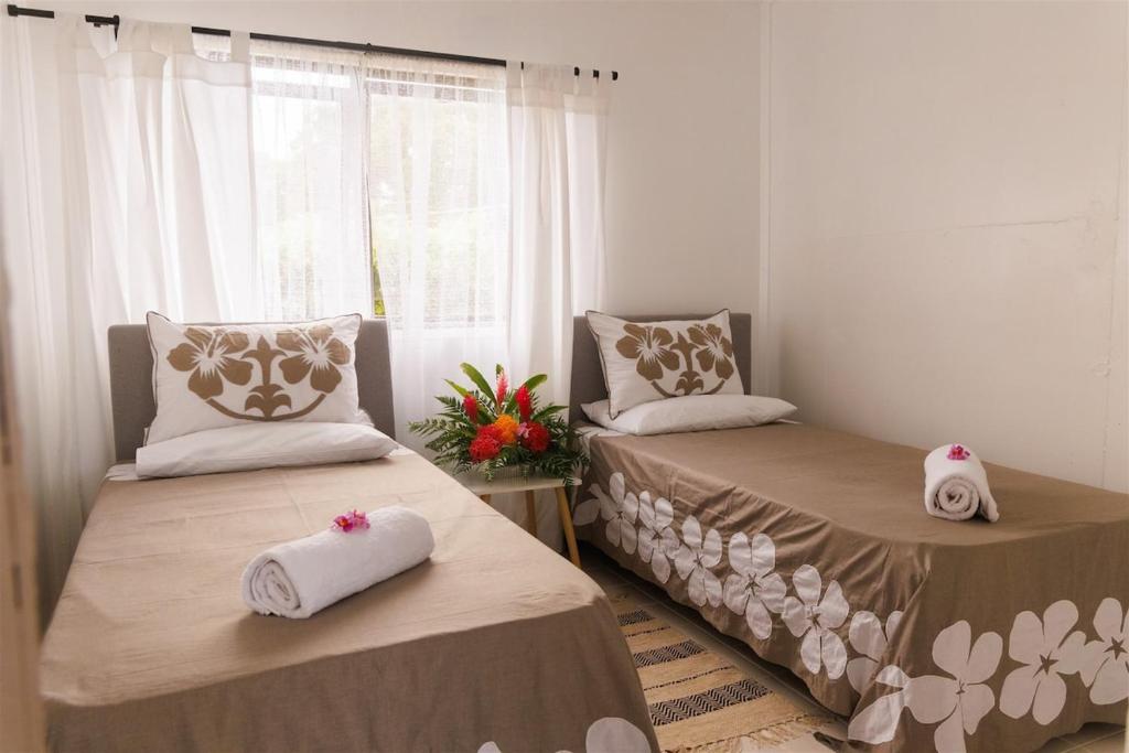 Postel nebo postele na pokoji v ubytování Atiu Guest House - Are Manuiri