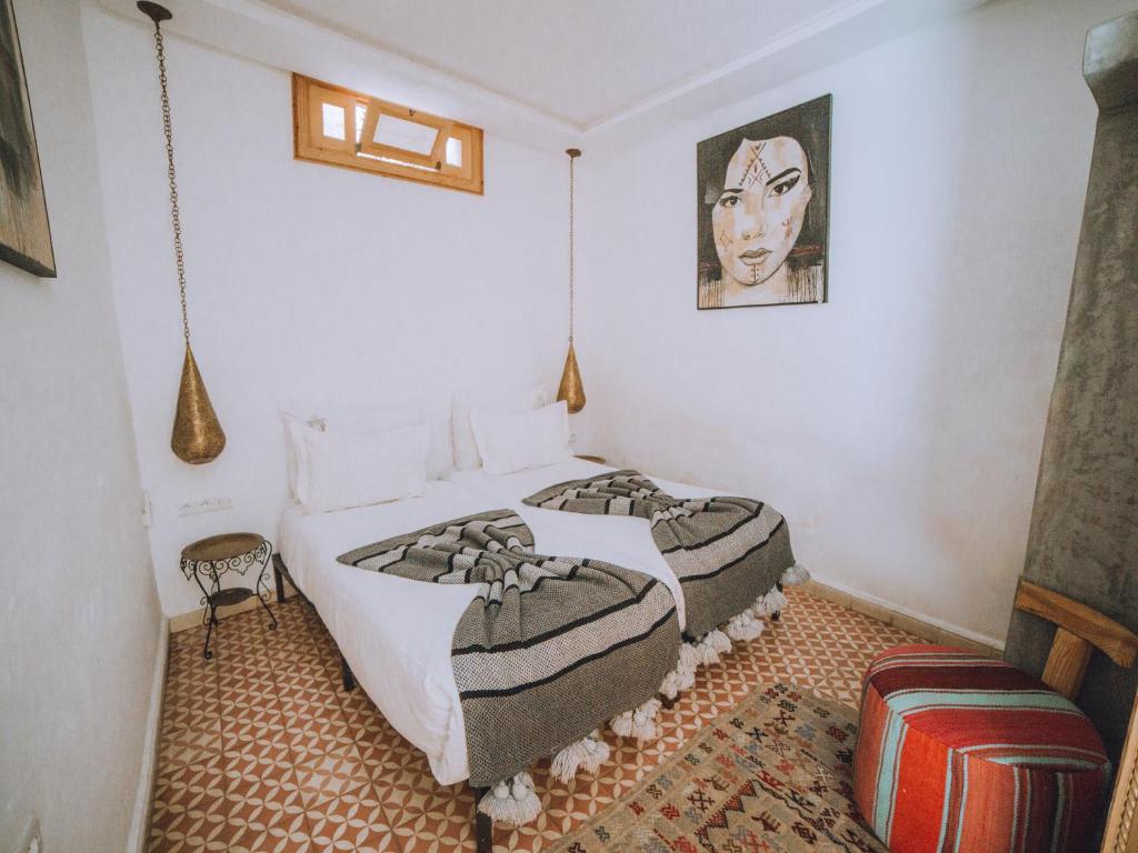 Postel nebo postele na pokoji v ubytování Riad Le Petit Joyau