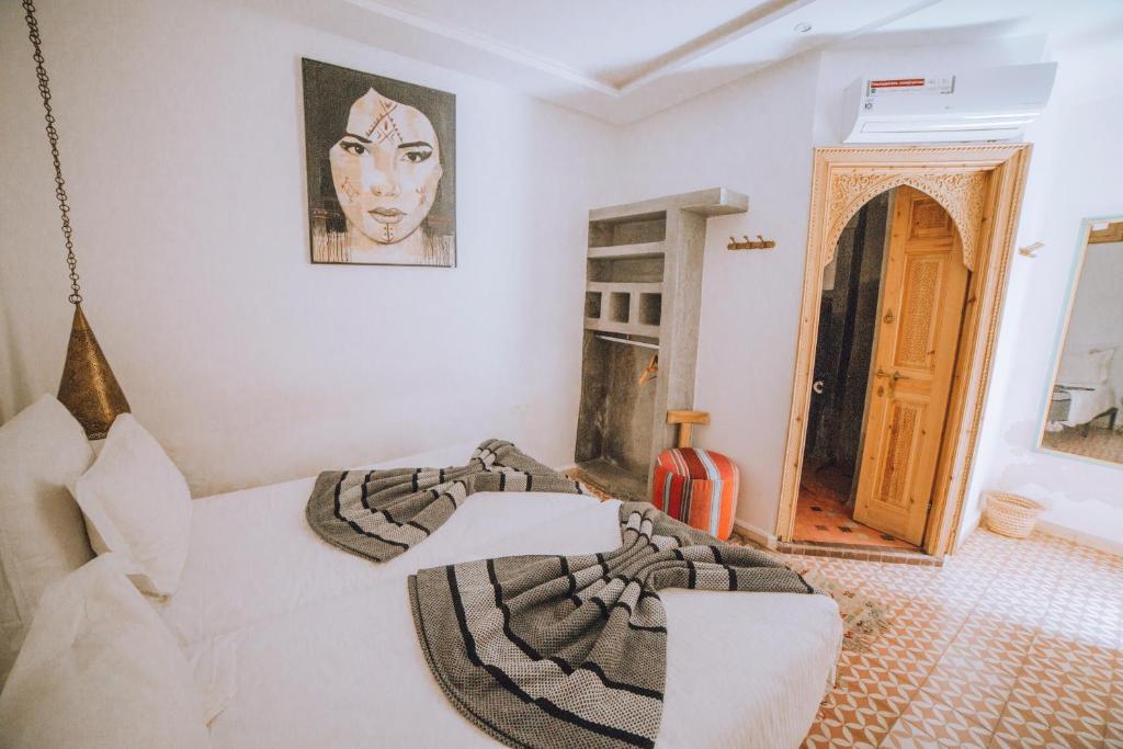 Postel nebo postele na pokoji v ubytování Riad Le Petit Joyau