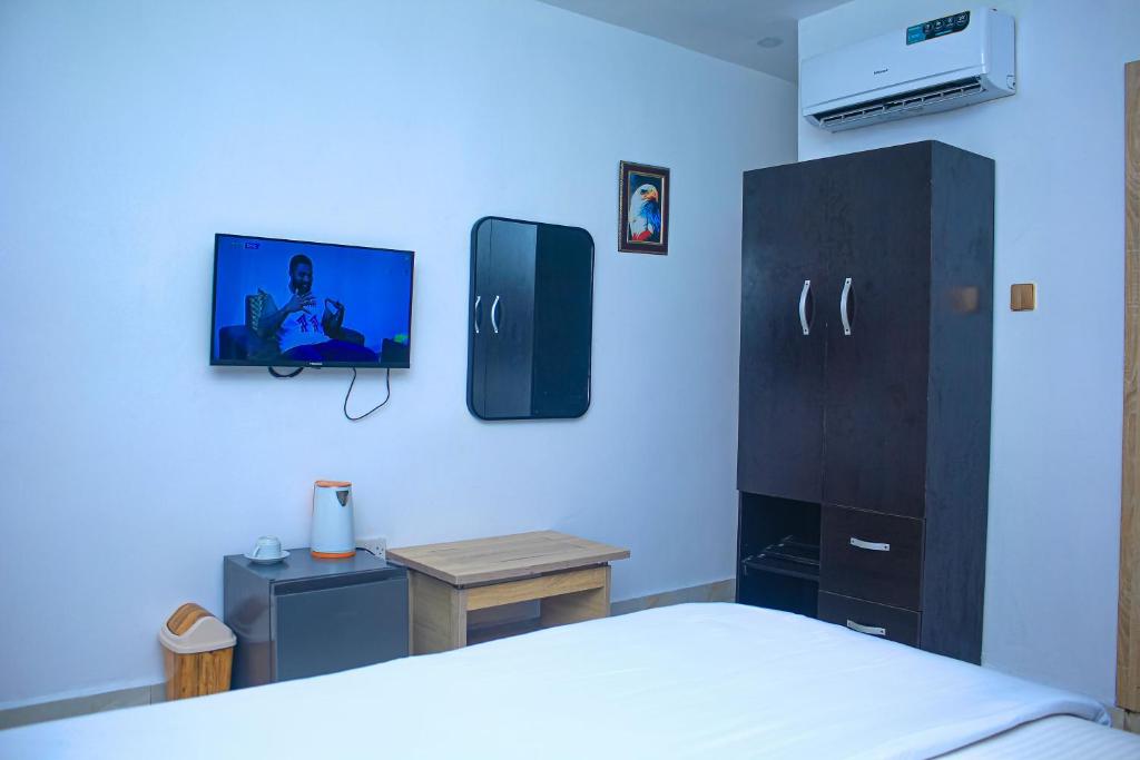Postel nebo postele na pokoji v ubytování Marquee Land Hotel
