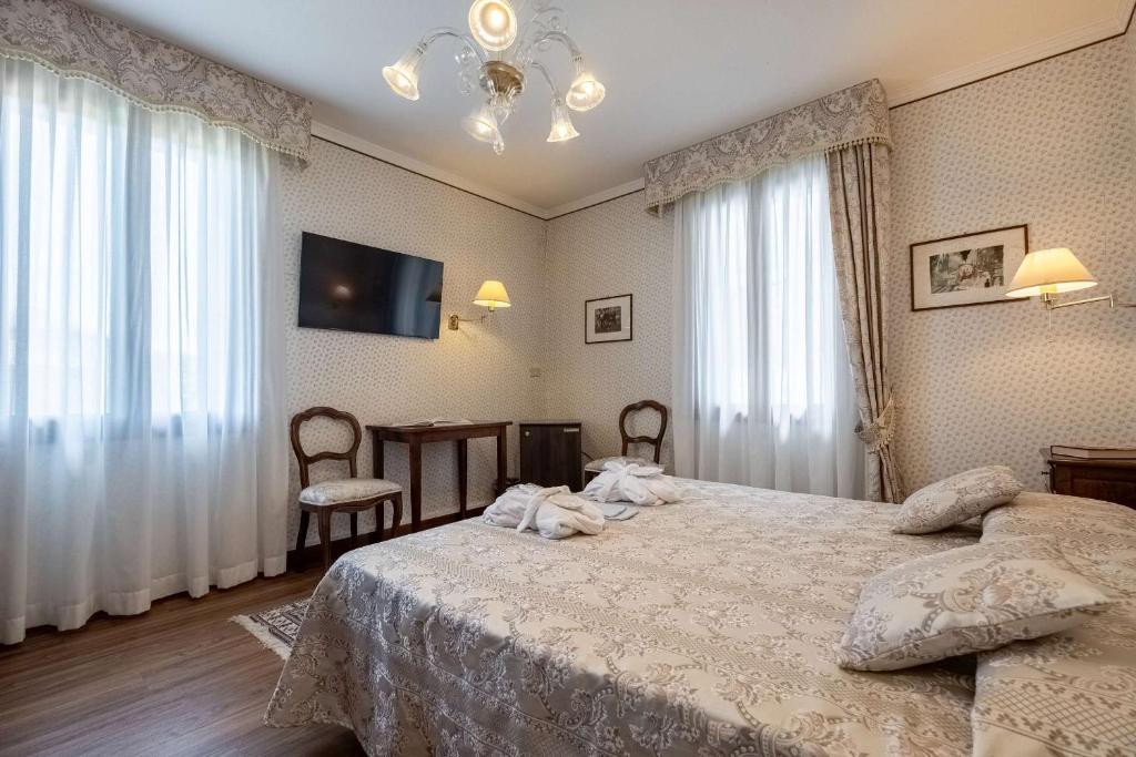 Voodi või voodid majutusasutuse Hotel La Meridiana toas